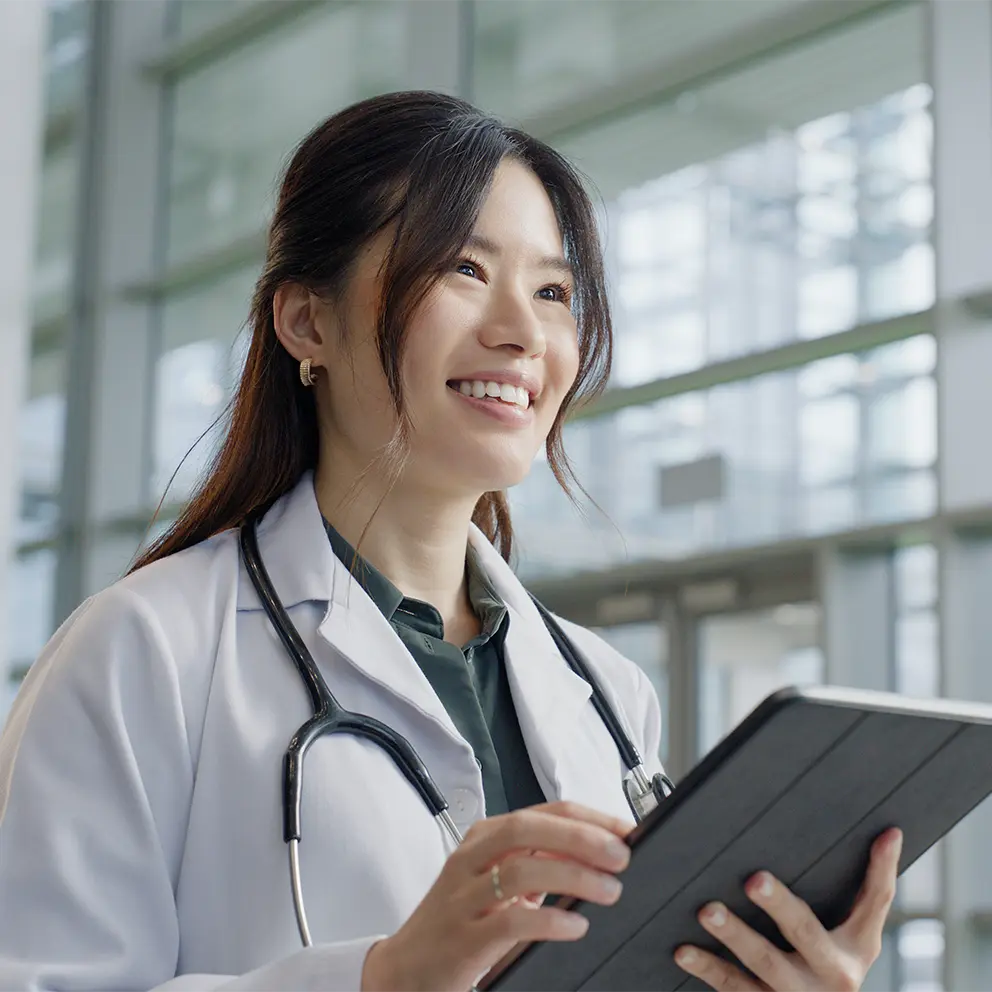 doctor shaking hands with business partner during meeting