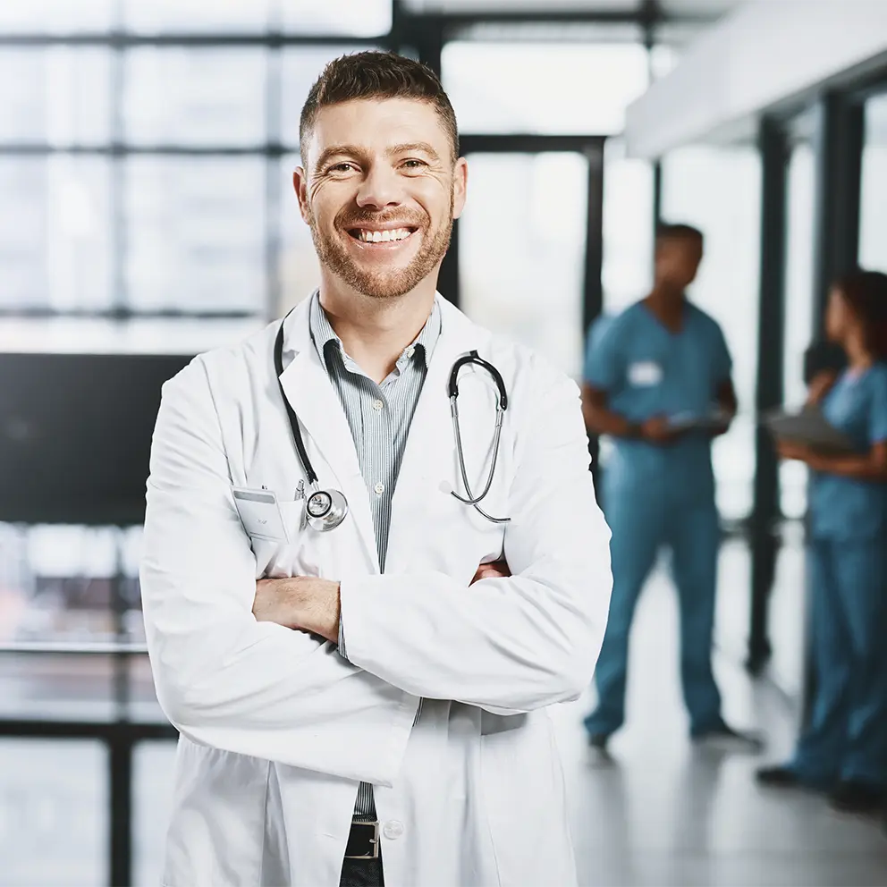 doctor shaking hands with business partner during meeting