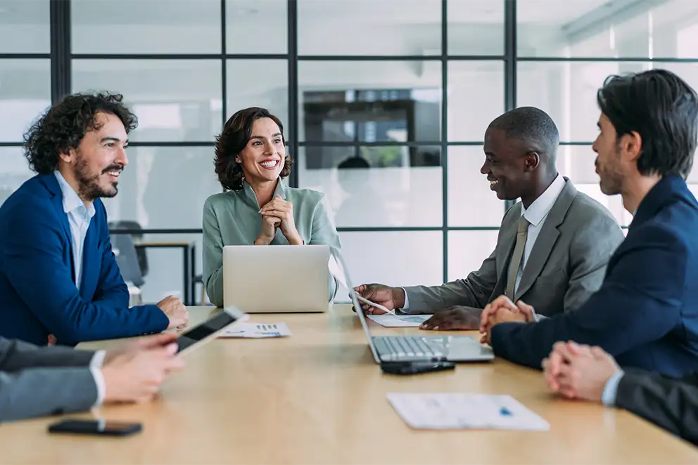 Doctors meeting with businessman at a conference table